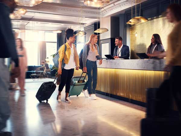 people checking into a hotel